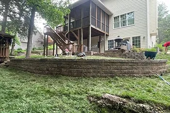 Retaining wall and green lawn at a home in Columbia, MO.
